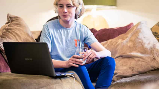 boy with headphones and laptop