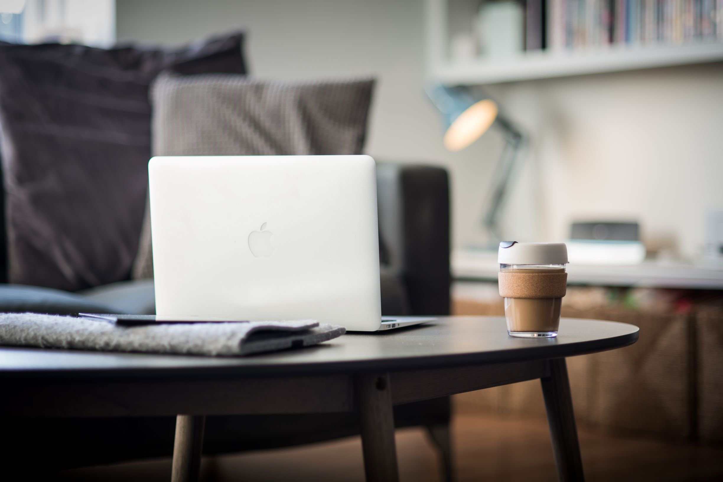 laptop and cup on table