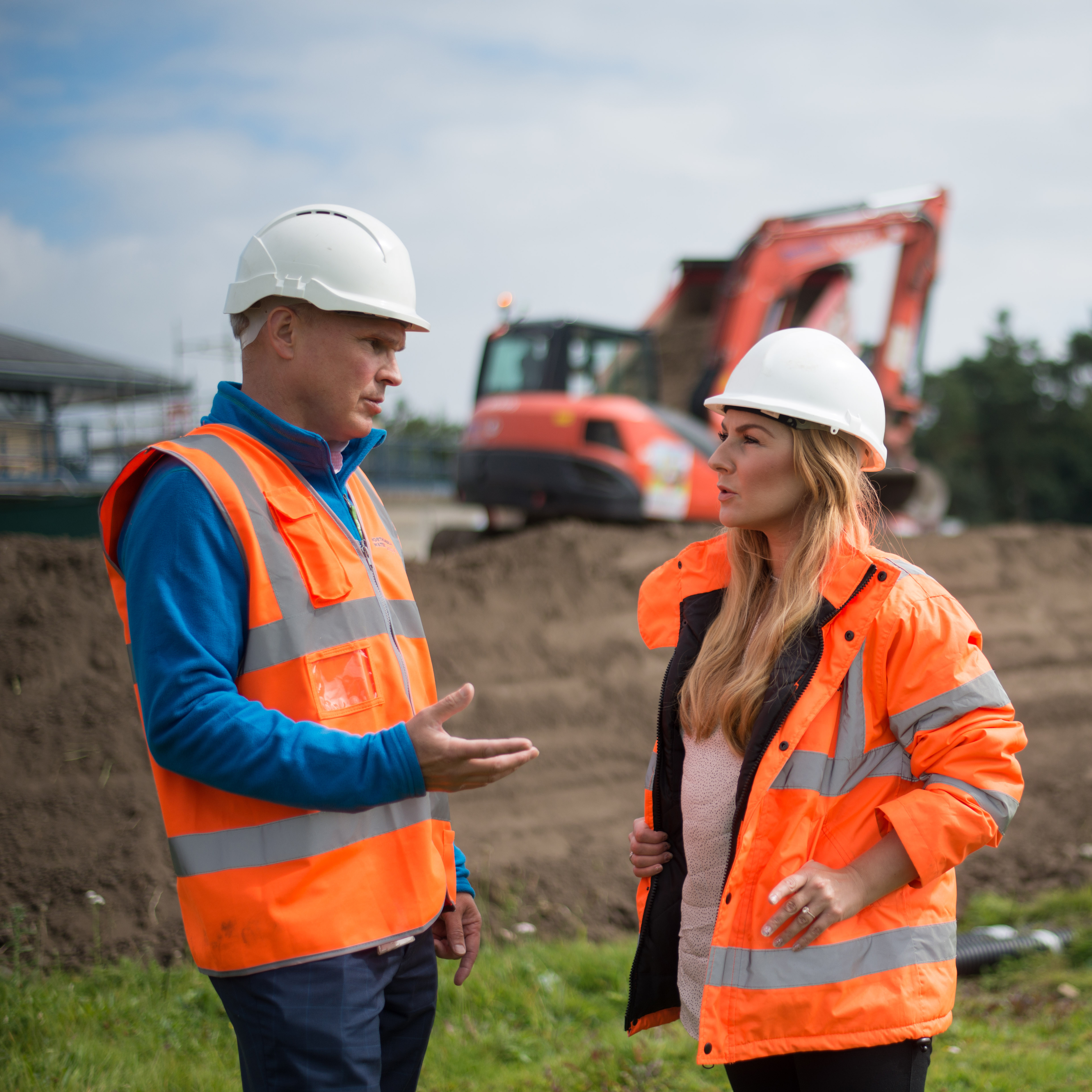 Northumbrian Water employees talking on building site