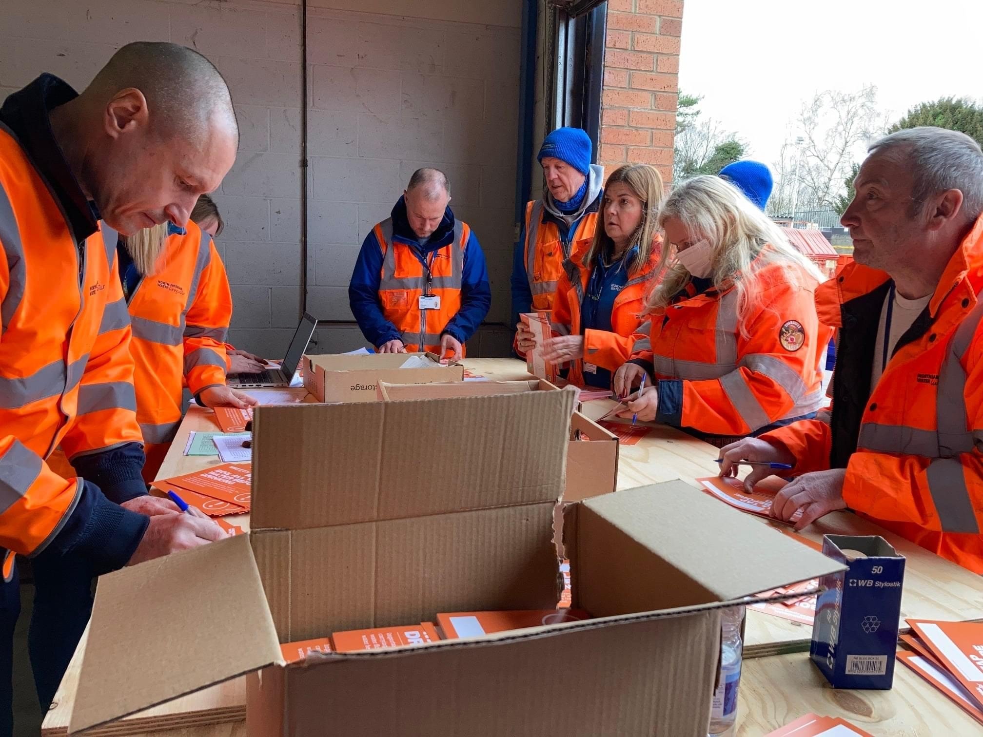 Northumbrian Water employees arranging letters