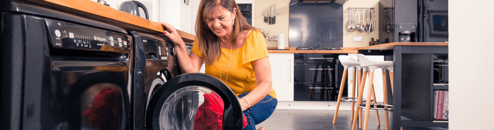 Woman filling washing machine