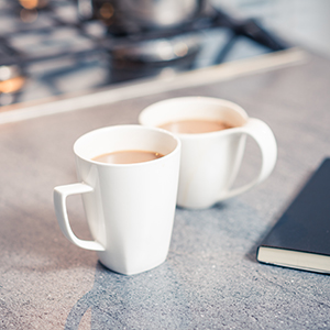 white mugs on kitchen worktop