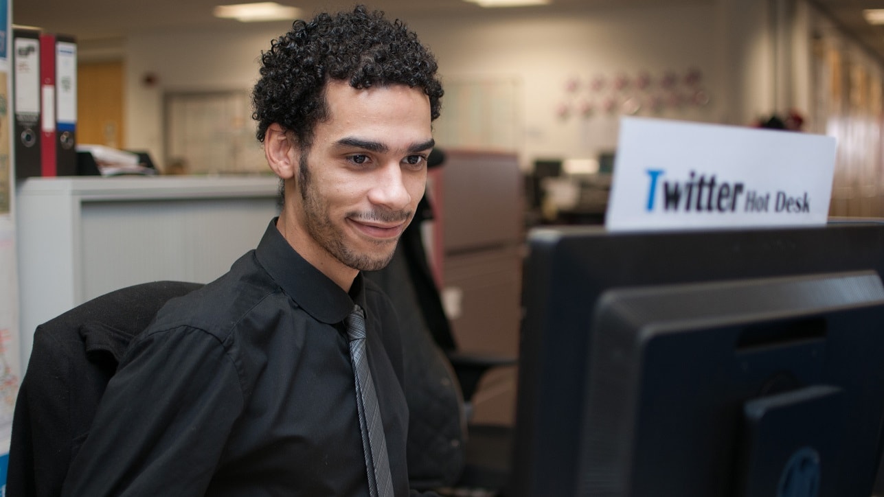 man on headset at computer