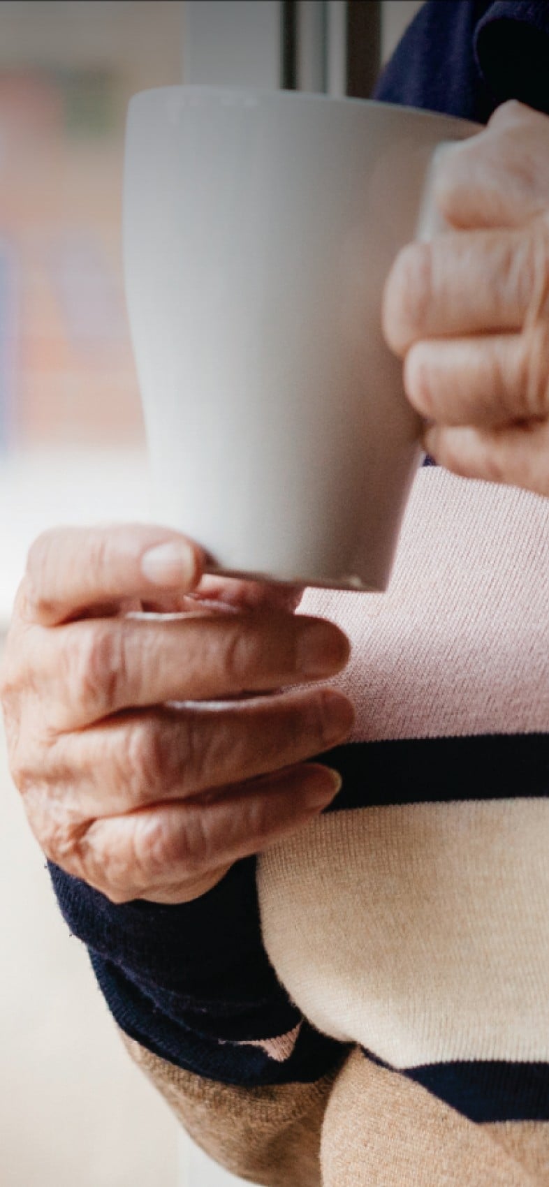 woman holding a cup of tea